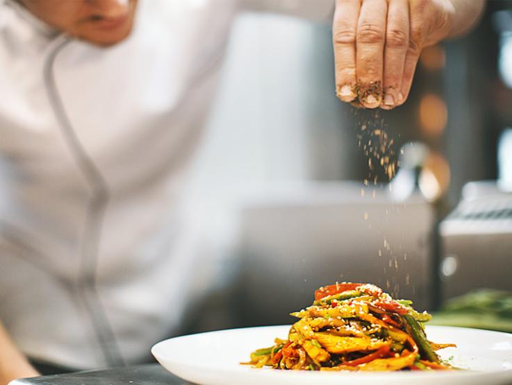 1069793714_768x576.jpg Chef garnishing dish