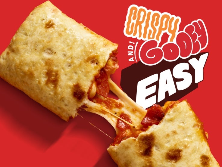 A cheesy Hot Pockets Pepperoni Pizza sandwich being pulled apart, showcasing stringy melted cheese, with the words &quot;crispy&quot;