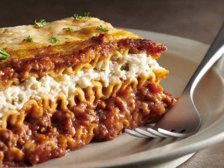 close up of Stouffers lasagna on white plate with fork