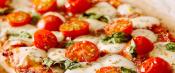Pizza with tomatoes and basil