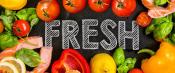 Fresh produce and meat with ‘Fresh’ written on chalkboard surface