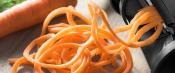 Fresh carrot sliced into spaghetti strands
