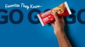 Grab and Go header image hand holding hot pocket