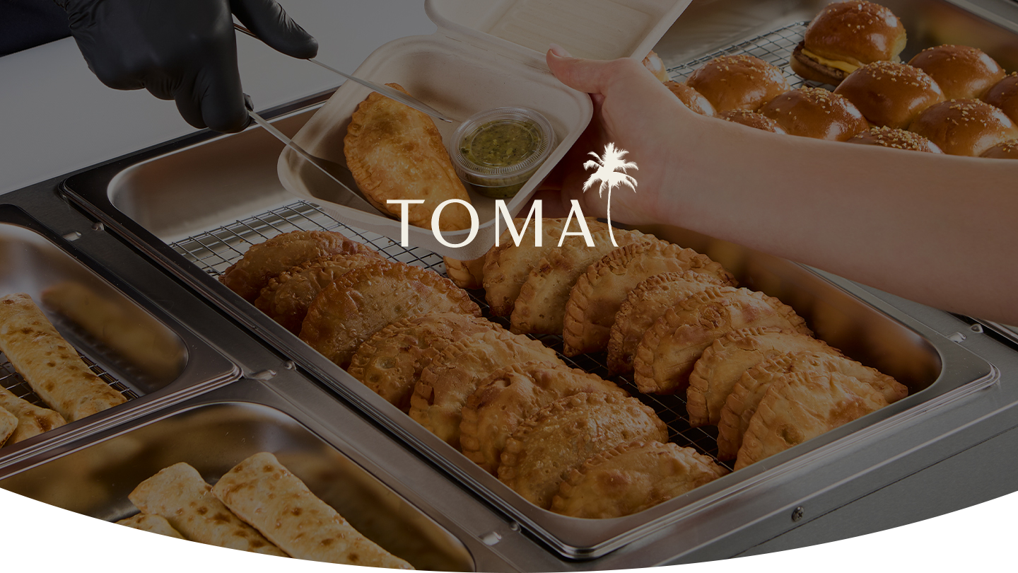 TOMA empanadas being served
